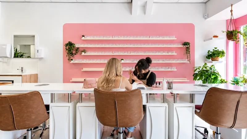 Nail technician working at the manicure table